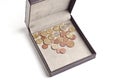 Different coins in open box Royalty Free Stock Photo