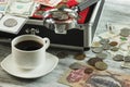 Different collector`s coins in the box and on the table