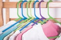 Different color clothes t-shirts on the rack Royalty Free Stock Photo