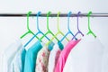 Different color clothes t-shirts on the rack Royalty Free Stock Photo