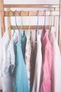 Different color clothes t-shirts on the rack Royalty Free Stock Photo