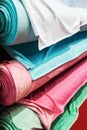 Different color textile fabrics in rolls at the factory Royalty Free Stock Photo