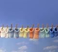 Different colored baby booties on a clothes line