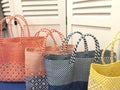 Line up of different colored beach bags Royalty Free Stock Photo