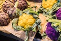 different colored cauliflowers and artichokes at a market stall Royalty Free Stock Photo