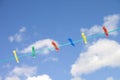 Different colored clothes pegs on a washing line line Royalty Free Stock Photo