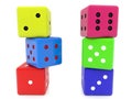 Different colored dice stacked in two columns Royalty Free Stock Photo