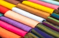 Different colored fabrics neatly folded for display. Closeup. Royalty Free Stock Photo