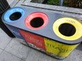 Different colored recycle garbage trash Bins on Shopping street at Orchard road. Royalty Free Stock Photo