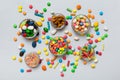 different colored round candy in bowl and jars. Top view of large variety sweets and candies with copy space Royalty Free Stock Photo