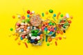 different colored round candy in bowl and jars. Top view of large variety sweets and candies with copy space Royalty Free Stock Photo