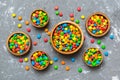 different colored round candy in bowl and jars. Top view of large variety sweets and candies with copy space Royalty Free Stock Photo