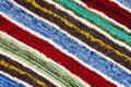 Different colored stripes on the knitted fabric surface.