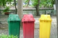 Different Colored Three Garbage Bins in public place