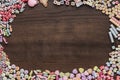 Different colorful beads on the wooden table Royalty Free Stock Photo