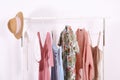 Different colorful casual clothing hanging in row Royalty Free Stock Photo