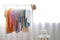 Different colorful casual clothing hanging in row Royalty Free Stock Photo