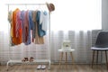 Different colorful casual clothing hanging in row Royalty Free Stock Photo