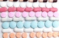 Different colorful drugs or medicine pills tablet and capsules supplements.