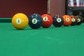 Different colorful numbered snooker balls placed in a line Royalty Free Stock Photo