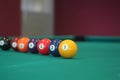 Different colorful numbered snooker balls placed in a line