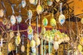 Different colorful painted Easter eggs on the tree at traditional European market Royalty Free Stock Photo