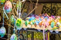 Different colorful painted Easter eggs on the tree at traditional European market Royalty Free Stock Photo