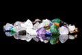 Different colorful rough gems, minerals and crystals in front of Royalty Free Stock Photo