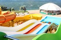 Different colorful slides in water park on day