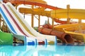 Different colorful slides in water park on day