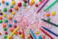 Colorful felt tip pen with sweets and scribble on white paper. Royalty Free Stock Photo