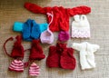different colors knitted doll clothes, adorable collection of knitted doll clothes