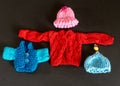 different colors knitted doll clothes, adorable collection of knitted doll clothes