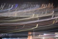Different colors of light trails from panning on the streets at night Royalty Free Stock Photo