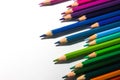 Numerous coloring pencils arranged in a line on the right side Royalty Free Stock Photo