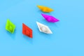 different colors paper boats on a bright blue surface - perfect serenity - diversity confidently keep afloat metaphor