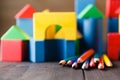 Different colors of pencils ontable with building blocks Royalty Free Stock Photo