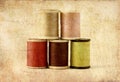 Different colors of thread spools, photo in old image Royalty Free Stock Photo