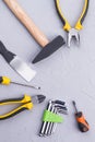 Different construction tools on gray background.