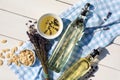 Different cooking oils and ingredients on white wooden table, flat lay Royalty Free Stock Photo