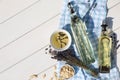 Different cooking oils and ingredients on white wooden table, flat lay. Space for text Royalty Free Stock Photo