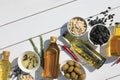 Different cooking oils and ingredients on white wooden table, flat lay. Space for text Royalty Free Stock Photo