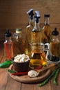 Different cooking oils and ingredients on wooden table Royalty Free Stock Photo