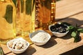 Different cooking oils and ingredients on wooden table, closeup Royalty Free Stock Photo