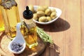 Different cooking oils and ingredients on wooden table, closeup. Space for text Royalty Free Stock Photo