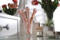 Different cosmetic brushes on dressing table. Interior element Royalty Free Stock Photo