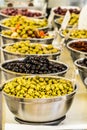 Different cured table olives in the bowls Royalty Free Stock Photo