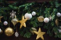 Different decorations hanging on the fir tree branches as lights, globes, stars and snowflakes symbolizing the beautiful Royalty Free Stock Photo