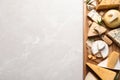 Different delicious cheeses served on grey table, top view. Space for Royalty Free Stock Photo