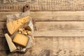 Different delicious cheeses served on wooden table, top view. Space for Royalty Free Stock Photo